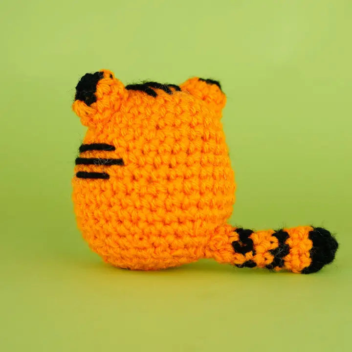 Back view of an orange crocheted tiger