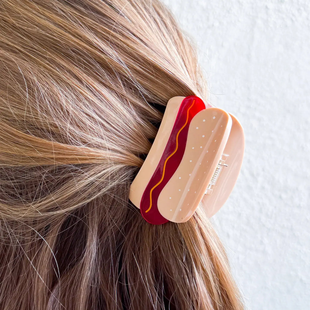 image of hot dog hair claw being worn in a half up half down style in dirty blonde straight hair 